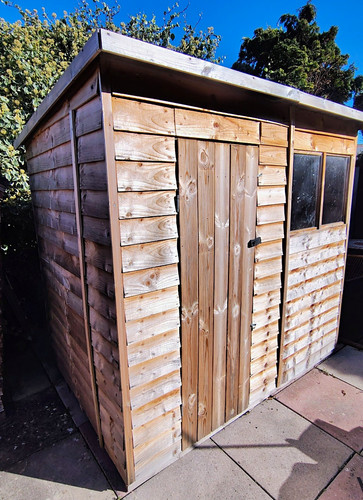Wooden brown pent - roof, garden